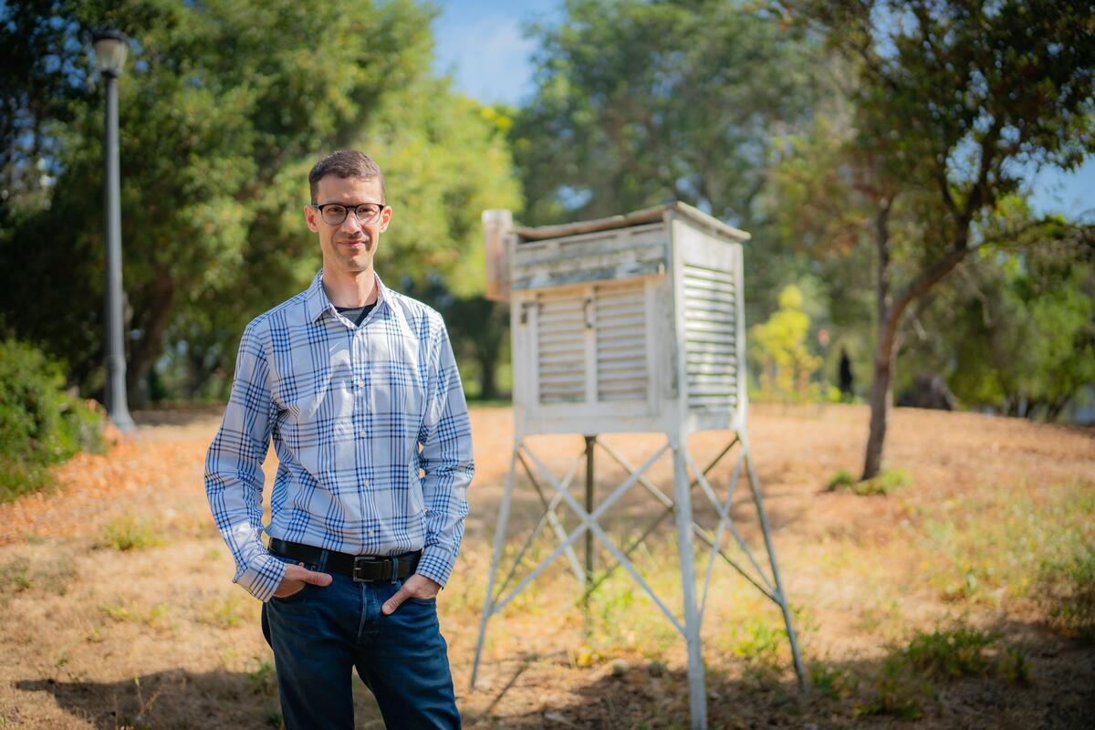 Professor Boos and a weather station on campus (Photo by Johnny Gan Chong)