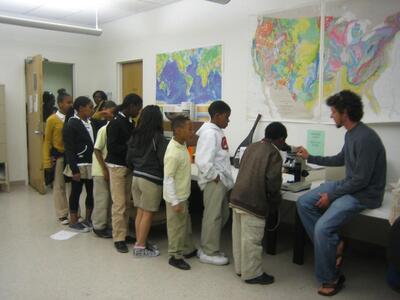 Students from Oakland Charter School visiting the Department with undergraduate student instructor